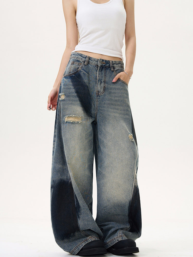 Distressed spray print vintage style denim pants