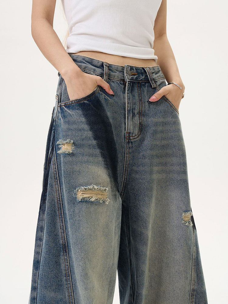 Distressed spray print vintage style denim pants