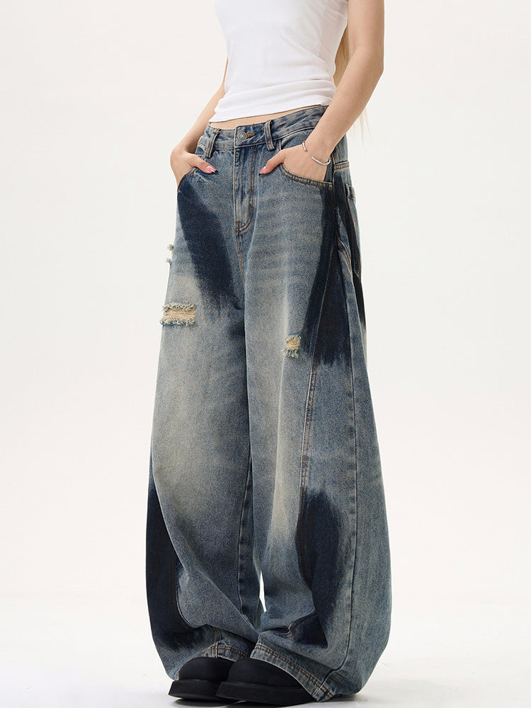 Distressed spray print vintage style denim pants