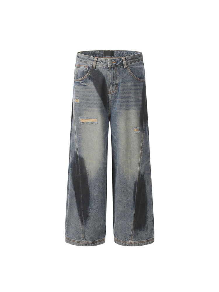 Distressed spray print vintage style denim pants