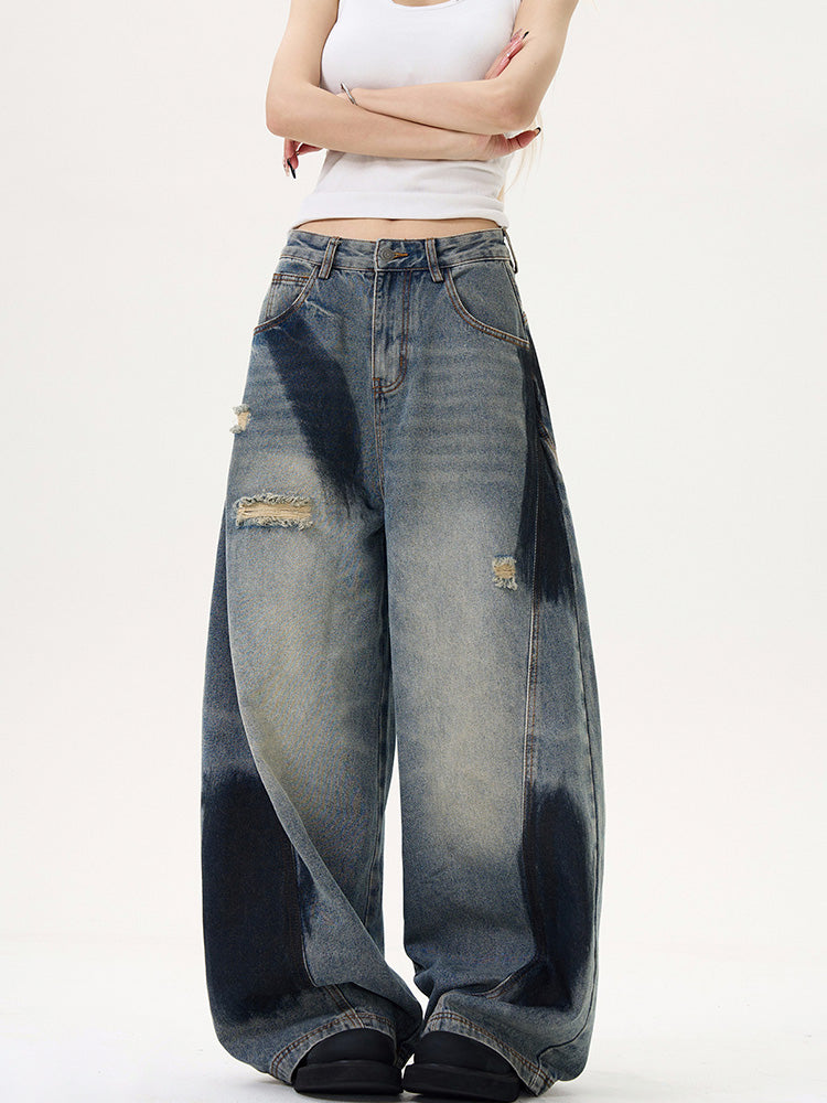 Distressed spray print vintage style denim pants